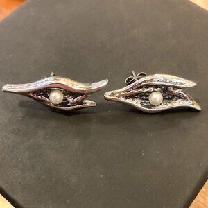 Organic brutalist earrings by Jean-Claude Darveau